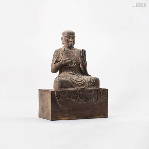 A Chinese wooden sculpture of a Luohan