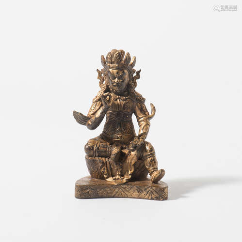 A Sino-Tibetan gilt-bronze figure of Vaishravana