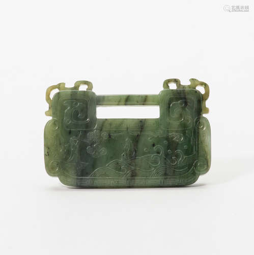 A Chinese spinach jade lock-shaped pendant