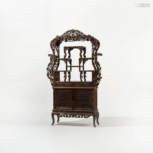 A Chinese carved hardwood display cabinet