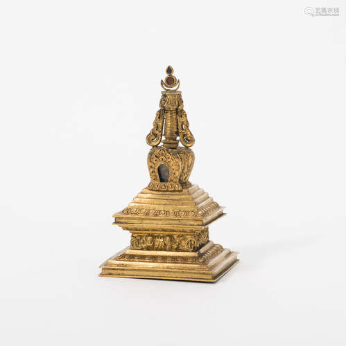 A Sino-Tibetan gilt repousse bronze model of a stupa