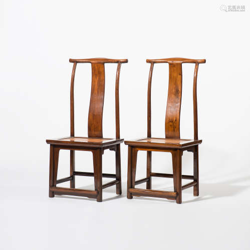A pair of Chinese hardwood yokeback chairs