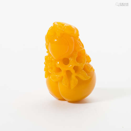 A Chinese yellow glas 'peach' carving