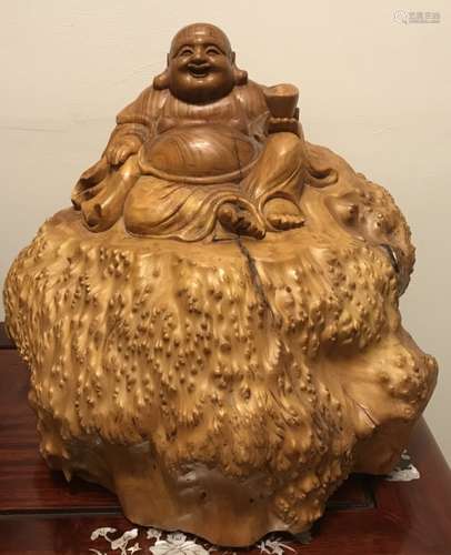 A Wood Carved Buddha Ornament