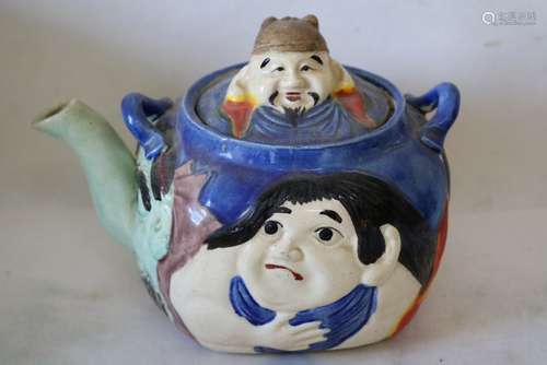 Porcelain Asian Teapot with Multiple Faces