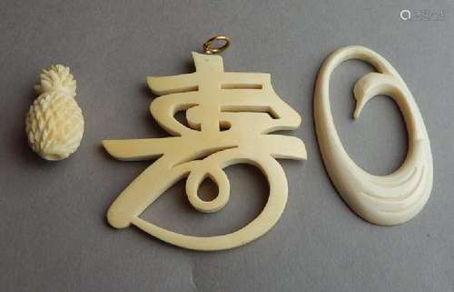 Three Carved Bone Pendants