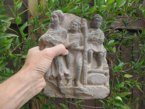 Gandhara, 3 Devotees with gifts to Buddha, carved stone