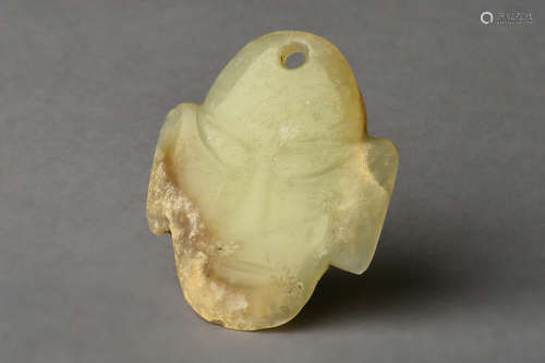 HONGSHAN CULTURE YELLOW JADE CARVED 'MASK' ORNAMENT