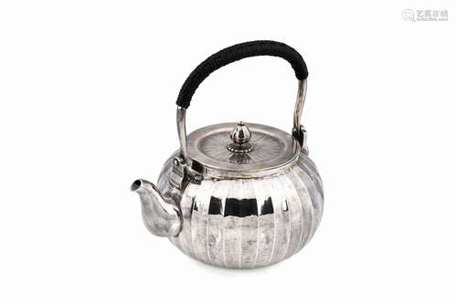 JAPANESE SILVER TEAPOT WITH LOBED PATTERN