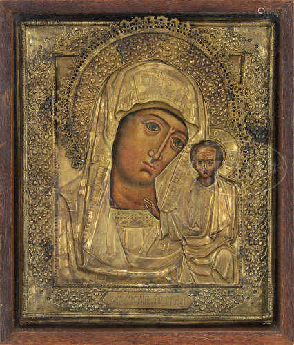 CASED RUSSIAN ICON WITH PAINTED FACES AND BRASS OVERLAY.