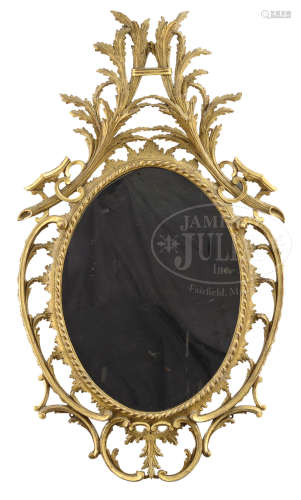 CHIPPENDALE TRANSITIONAL GILT WOOD LEAF CARVED OVAL MIRROR AND HEPPLEWHITE CLASSICAL CARVED GILT WOOD MIRROR.