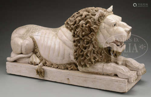 MONUMENTAL CARVED AND PAINTED RECLINING LION.