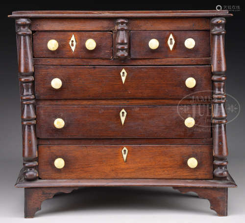 SHERATON WALNUT DOLL’S CHEST OF DRAWERS.