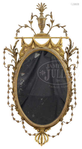FINE HEPPLEWHITE CLASSICAL CARVED GILT WOOD OVAL MIRROR.