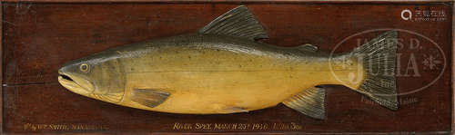 CARVED SALMON TROPHY MOUNTED ON DISPLAY BOARD.