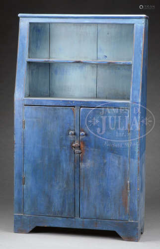 ARCHITECTURAL CANT-BACK OPEN-TOP CUPBOARD IN BLUE PAINT.