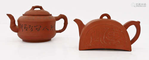 2pc Chinese Yixing Teapots. Includes a teapot with carved calligraphy