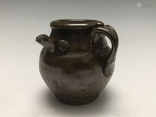 A BROWN-GLAZED WATER POT