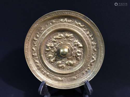 A GILT-BRONZE CIRCULAR MIRROR