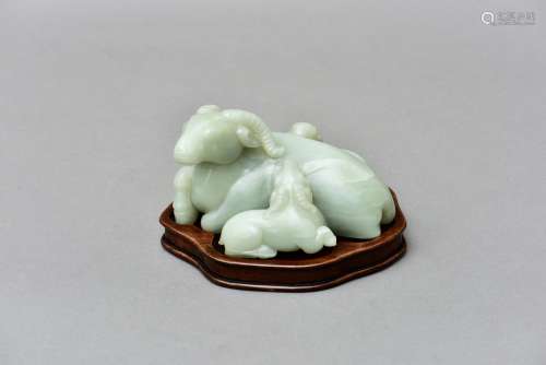 A WHITE JADE CARVING OF THREE RAMS, 18TH CENTURY
