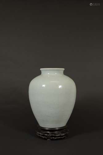 A CARVED CELADON-GLAZED LOTUS JAR, QING DYNASTY