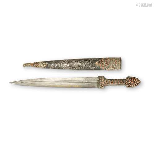 A Middle Eastern steel blade with inlaid gold script, embellished silver scabbard and hilt,