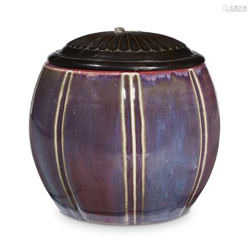 An unusual Chinese flambe-glazed porcelain barrel-form jar with hardwood cover,