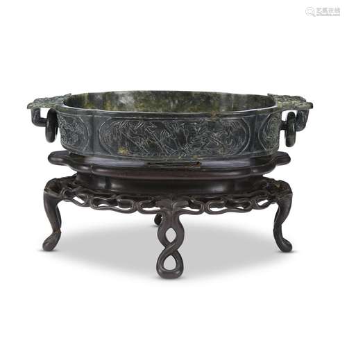 A Chinese spinach jade marriage bowl on carved wood stand,