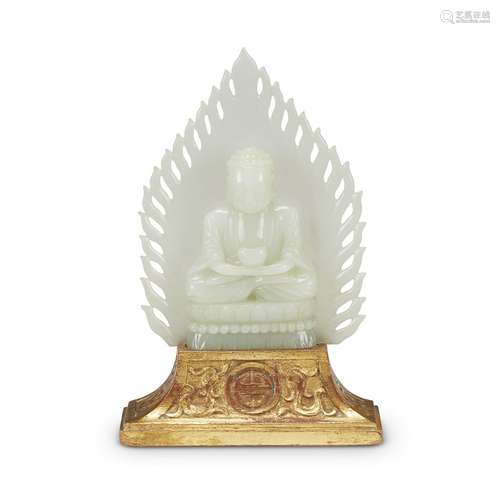 A Chinese carved pale celadon jade seated figure of a Medicine Buddha, Baisajyaguru,