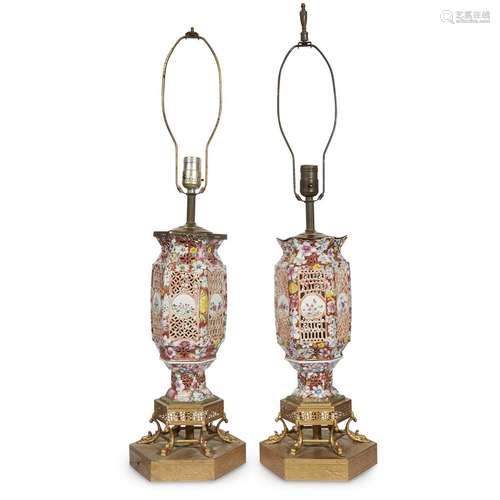 Pair of Chinese famille rose-decorated porcelain pierced lanterns, now mounted as lamps,