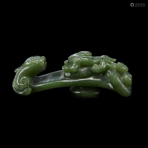 A Chinese dark green jadeite 'qilong' belthook and two glass pendants,