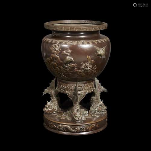 A Japanese patinated bronze jardiniere with fish base,, late 19th/early 20th century