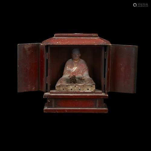 A Japanese red-lacquered Buddhist shrine, enclosing a monk, Possibly late Edo period