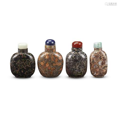 Group of four Chinese hardstone snuff bottles,