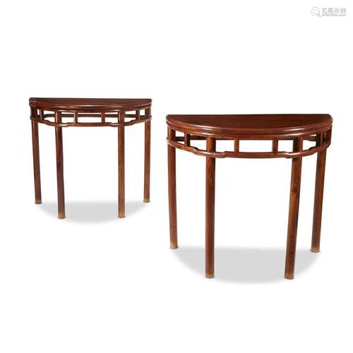 A pair of Chinese huanghuali demilune side tables,