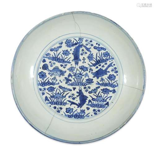 A large Chinese blue and white 'Fish and Lotus' circular dish, six-character Jiajing mark and probably of the period