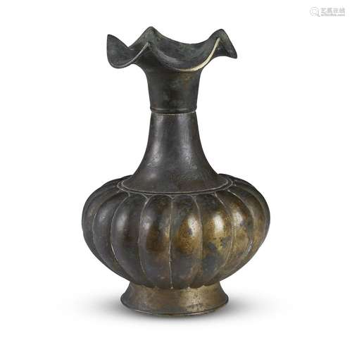 A patinated and incised bronze lobed vase with crimped and flared lip, possibly Korean,