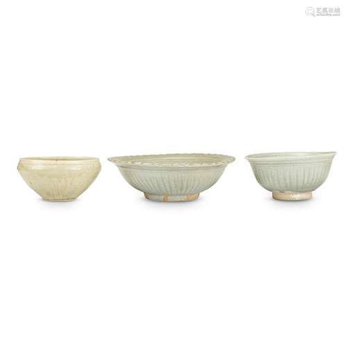 A Vietnamese incised celadon-glazed bowl, and a Thai celadon-glazed dish and a bowl, the Vietnamese bowl 13th-14th century