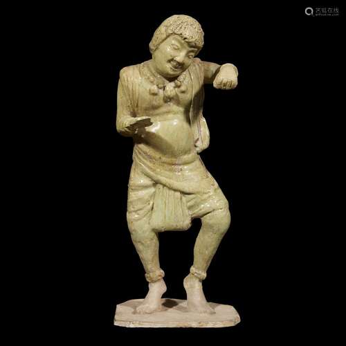 A Chinese straw-glazed figure of a foreign dancer, tang dynasty