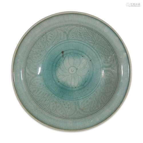 A Thai celadon-glazed dish with incised lotus, sawankhalok kilns, 14th-16th century