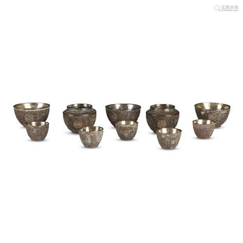 Group of ten Chinese silver-lined carved coconut shell cups and small vessels,