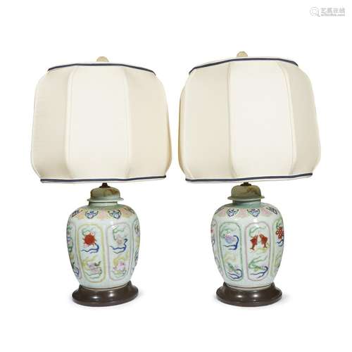 Pair of Chinese molded and enameled celadon-ground porcelain jars and covers, mounted as lamps,