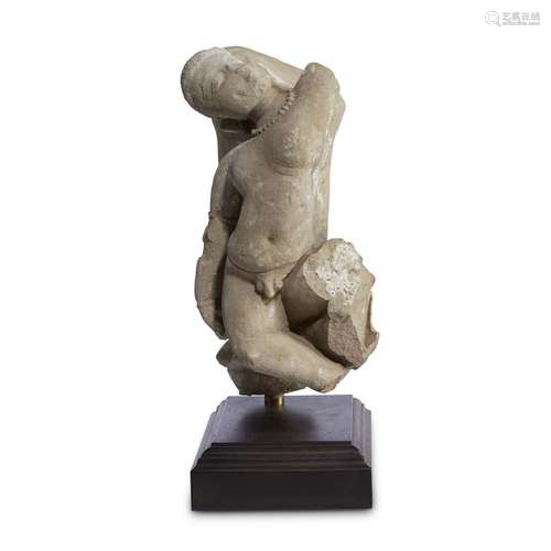 An Indian carved buff sandstone figure of a dancing boy, circa 12th-13th century