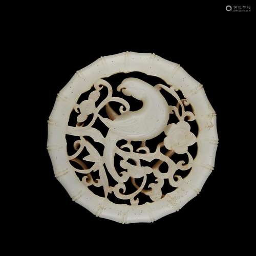 A Chinese white jade circular 'bird and flower' pendant,