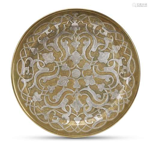 A Mamluk revival silver-inlaid brass circular charger,