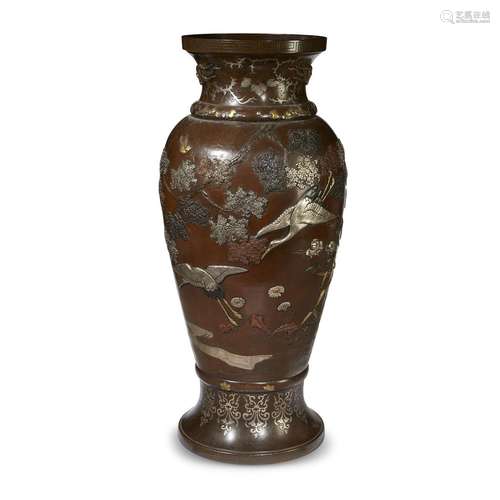 An impressive Japanese patinated bronze and mixed-metal vase, decorated with cranes among flowering trees, late 19th century