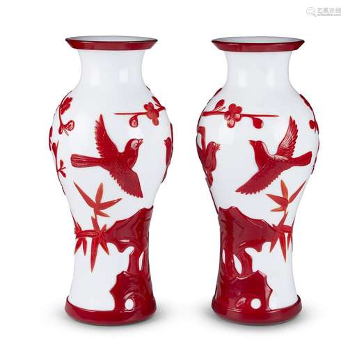 A pair of Chinese ruby-overlaid white Peking glass Bird and Flowering Branches vases,