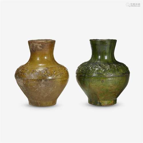 A Chinese yellow glazed and a green glazed pottery wine jar, Hu, western han dynasty