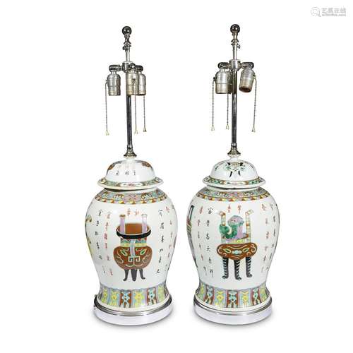 A pair of Chinese enameled porcelain jars and covers, decorated with antiques, later mounted as lamps,