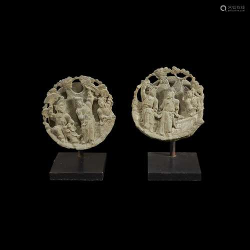 Pair of Chinese carved and pierced stone figural roundels, qing dynasty